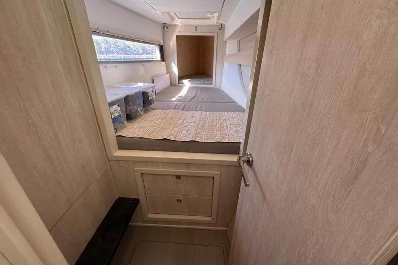 Daylight Yacht Photos Pics Interior cabin of 2018 Leopard 40 catamaran with bed and storage.