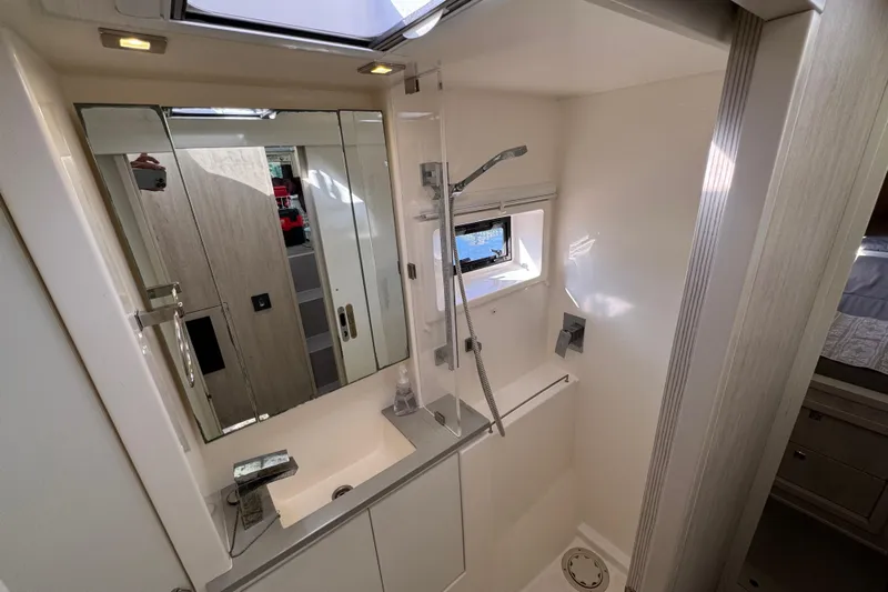 Daylight Yacht Photos Pics Modern bathroom interior in 2018 Leopard 40 yacht, featuring shower and sink.