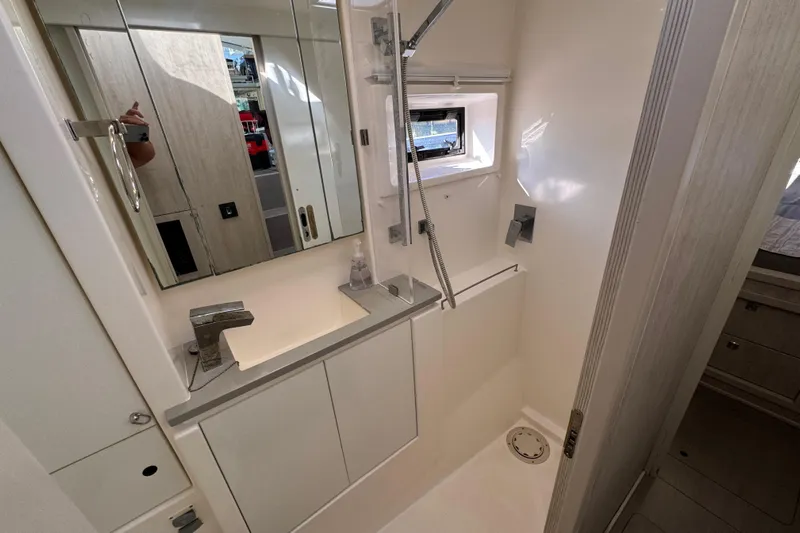 Daylight Yacht Photos Pics Modern bathroom in 2018 Leopard 40 yacht with sleek fixtures and mirror.