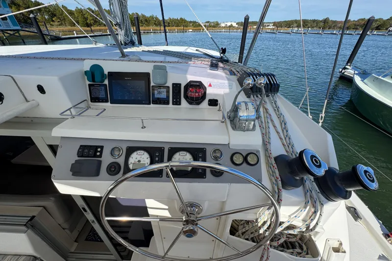 Daylight Yacht Photos Pics Helm of 2018 Leopard 40 catamaran with navigation instruments and steering wheel.