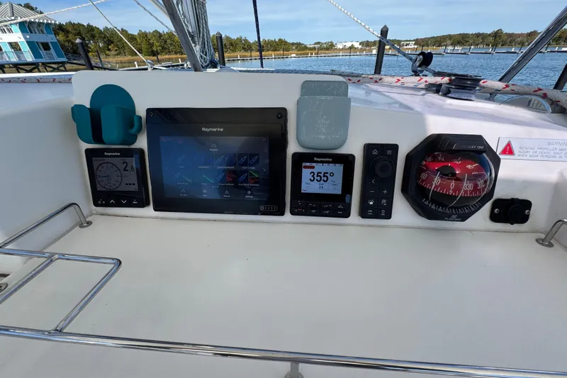 Daylight Yacht Photos Pics Control panel of a 2018 Leopard 40 catamaran with navigation instruments and compass.