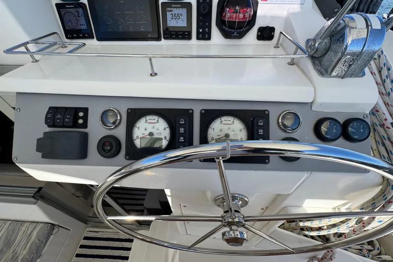 Daylight Yacht Photos Pics Steering console of a 2018 Leopard 40 catamaran with navigation instruments and gauges.