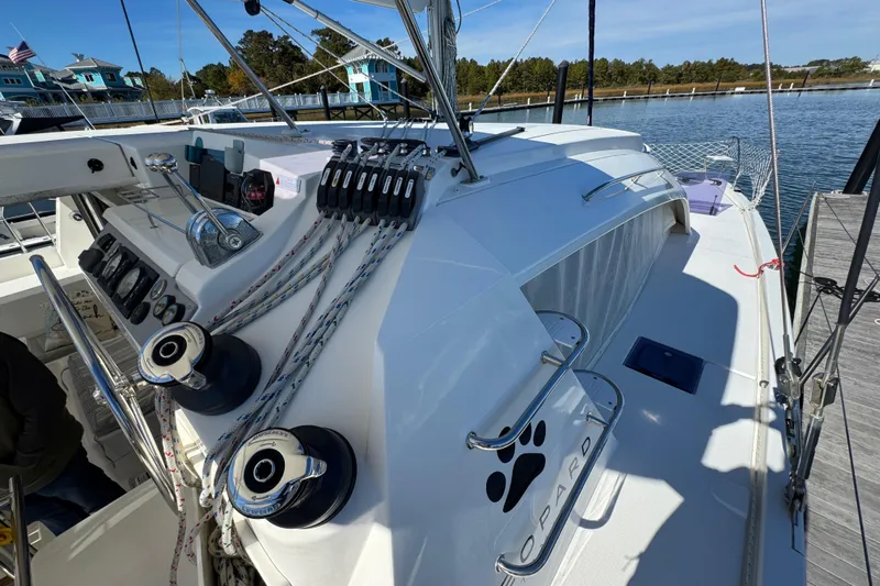 Daylight Yacht Photos Pics 2018 Leopard 40 catamaran with modern deck and sailing equipment at a marina.