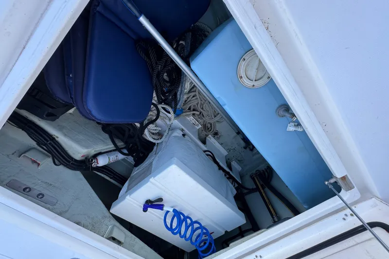 Daylight Yacht Photos Pics Storage compartment of a 2018 Leopard 40 boat with ropes and equipment.
