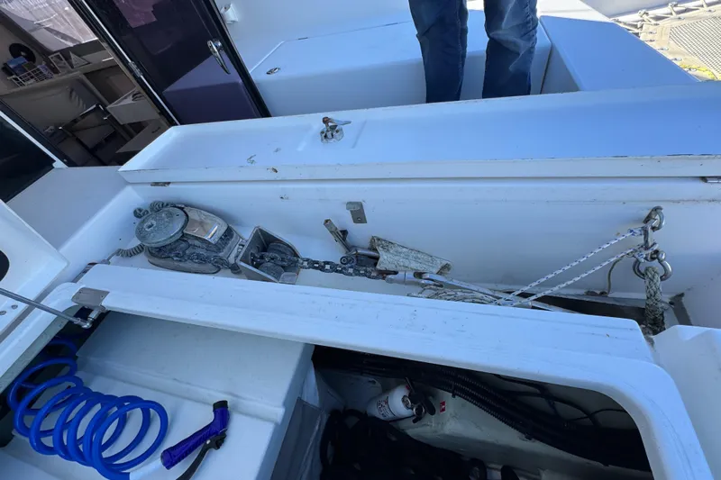 Daylight Yacht Photos Pics 2018 Leopard 40 yacht deck with anchor chain and storage compartment.