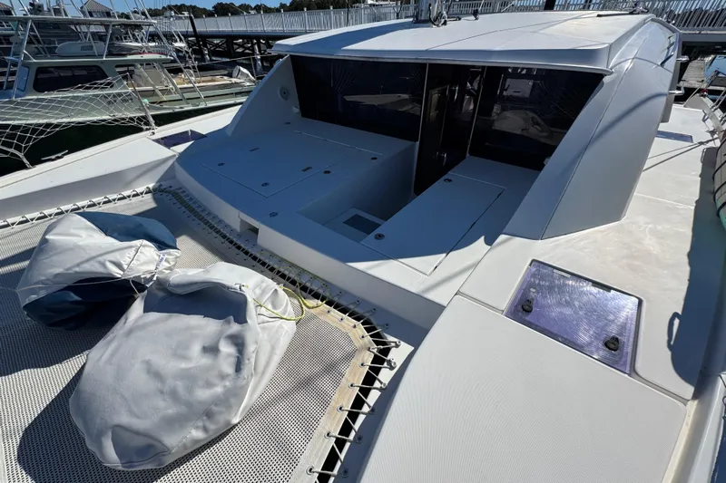 Daylight Yacht Photos Pics 2018 Leopard 40 catamaran deck with storage compartments and covered equipment.