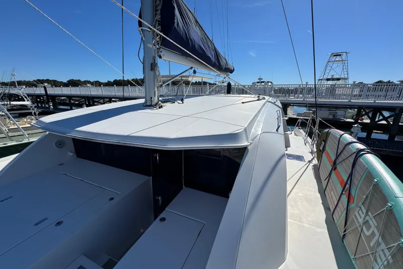 Daylight Yacht Photos Pics 2018 Leopard 40 catamaran docked, featuring sleek design and spacious deck area.