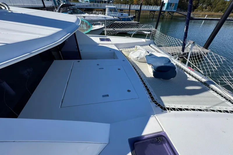 Daylight Yacht Photos Pics 2018 Leopard 40 catamaran docked, featuring spacious deck and netting.