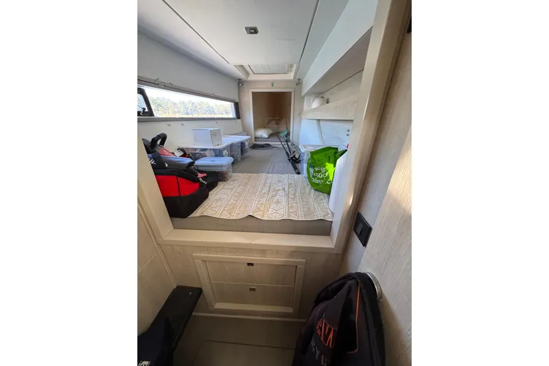 Daylight Yacht Photos Pics Interior of a 2018 Leopard 40 catamaran, featuring storage and seating area.