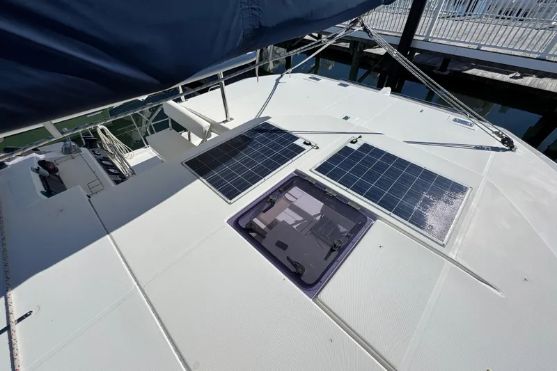 Daylight Yacht Photos Pics 2018 Leopard 40 catamaran with solar panels on deck, docked at marina.