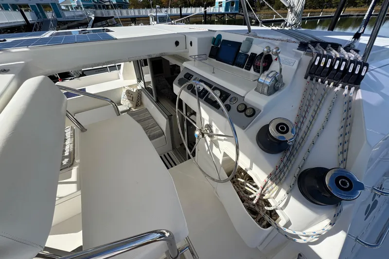 Daylight Yacht Photos Pics Cockpit of 2018 Leopard 40 catamaran with steering wheel, control panel, and winches.