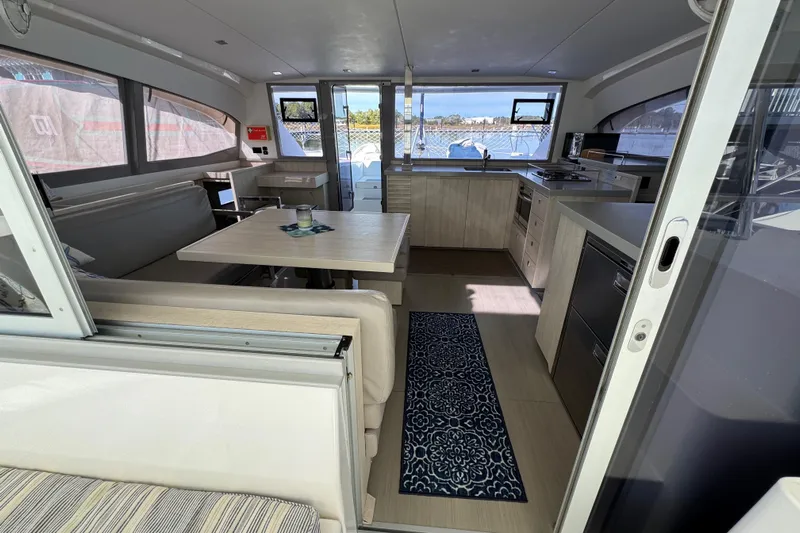 Daylight Yacht Photos Pics Modern interior of 2018 Leopard 40 catamaran with spacious dining and kitchen area.