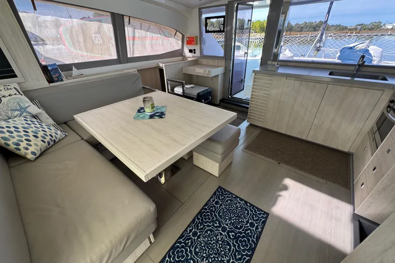 Daylight Yacht Photos Pics Interior of 2018 Leopard 40 catamaran with modern dining area and scenic window views.