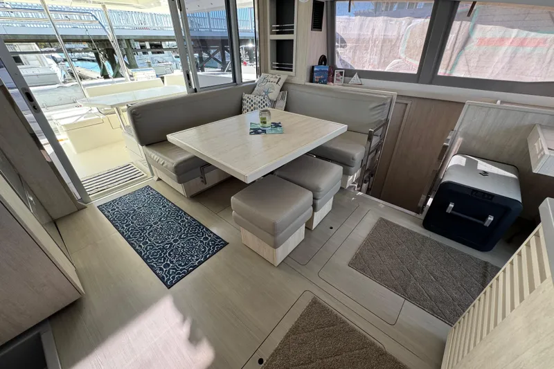 Daylight Yacht Photos Pics Interior of 2018 Leopard 40 catamaran with dining area and modern furnishings.
