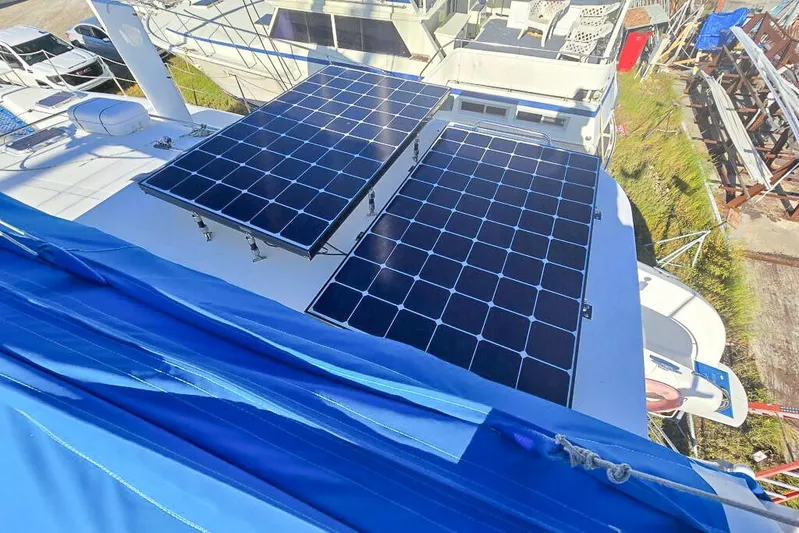 Miss Roxy Yacht Photos Pics Solar panels on a 2006 Dolphin 460 yacht, with blue sail cover visible.