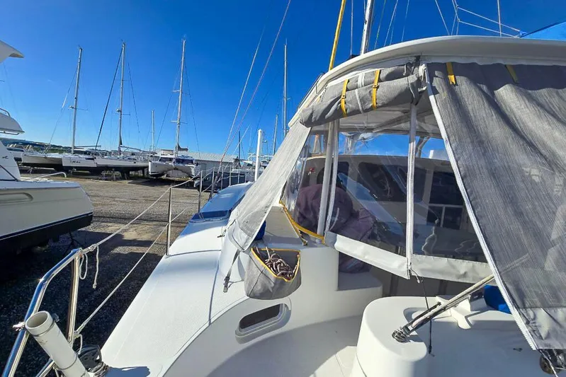Miss Roxy Yacht Photos Pics Sailboats docked at marina, featuring a 2006 Dolphin 460 catamaran under clear blue skies.