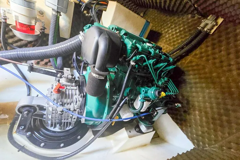 Miss Roxy Yacht Photos Pics Engine compartment of a 2006 Dolphin 460, showcasing mechanical components and wiring.