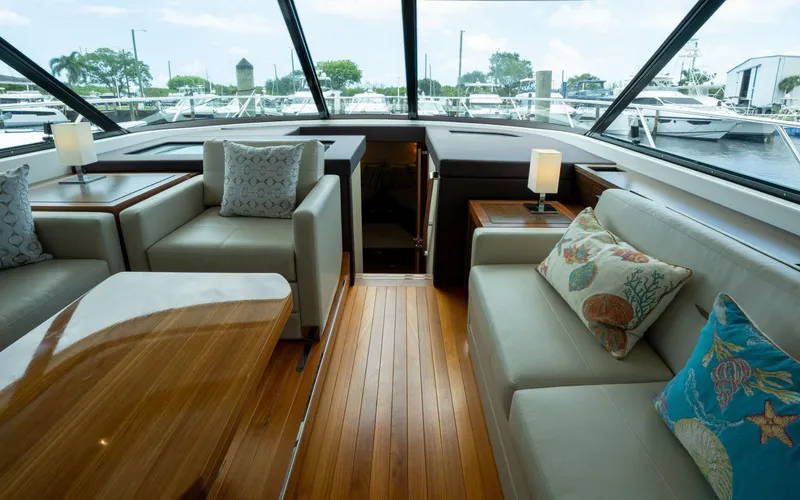 True North Yacht Photos Pics Luxurious interior of 2017 Tiara Yachts F53 Flybridge with elegant seating and wooden flooring.
