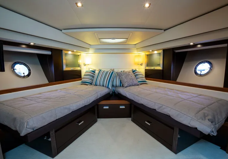 True North Yacht Photos Pics Luxurious 2017 Tiara Yachts F53 Flybridge cabin with twin beds and elegant decor.
