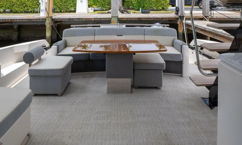 True North Yacht Photos Pics 2017 Tiara Yachts F53 Flybridge interior with elegant seating and wooden table.