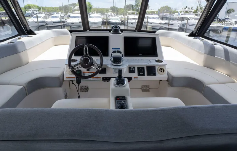 True North Yacht Photos Pics 2017 Tiara Yachts F53 Flybridge helm with dual screens and modern controls.