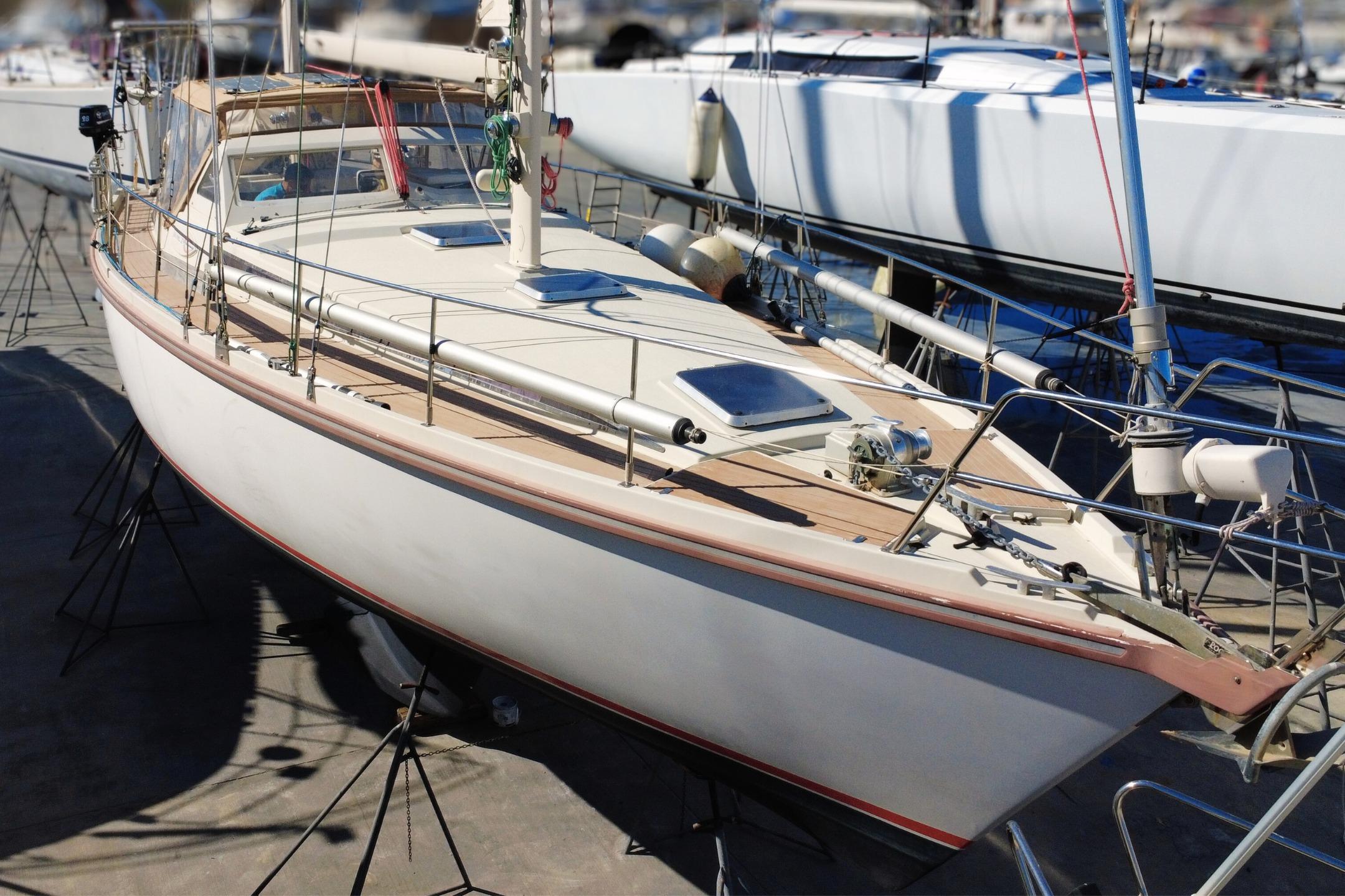 1995 Amel Santorin 46 sailboat on stands, showcasing sleek design and craftsmanship.