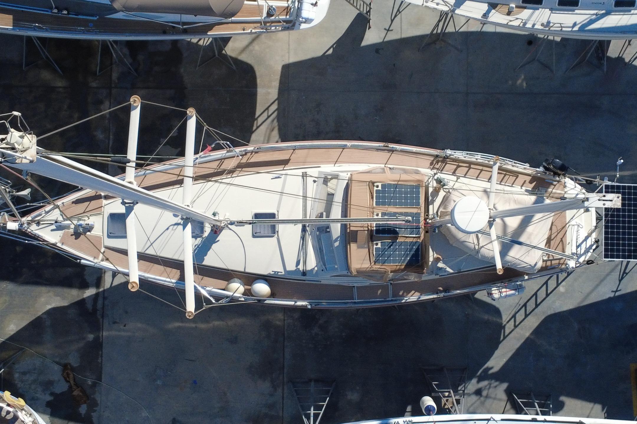 Overhead view of a 1995 Amel Santorin 46 sailboat on dry dock.