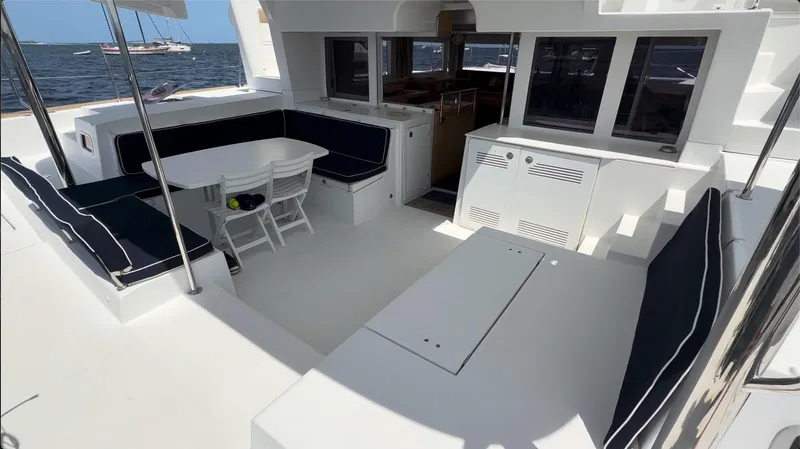 Ivana V Yacht Photos Pics Spacious deck of 2012 Lagoon 450 catamaran with seating and dining area.