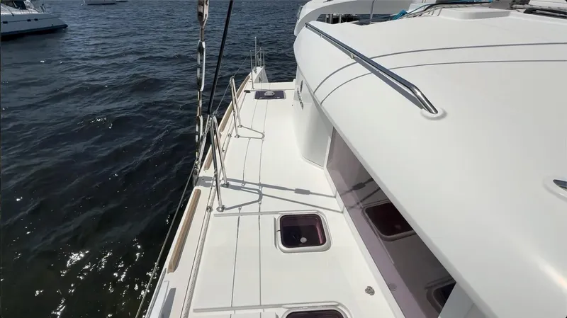 Ivana V Yacht Photos Pics 2012 Lagoon 450 catamaran deck view on calm waters.