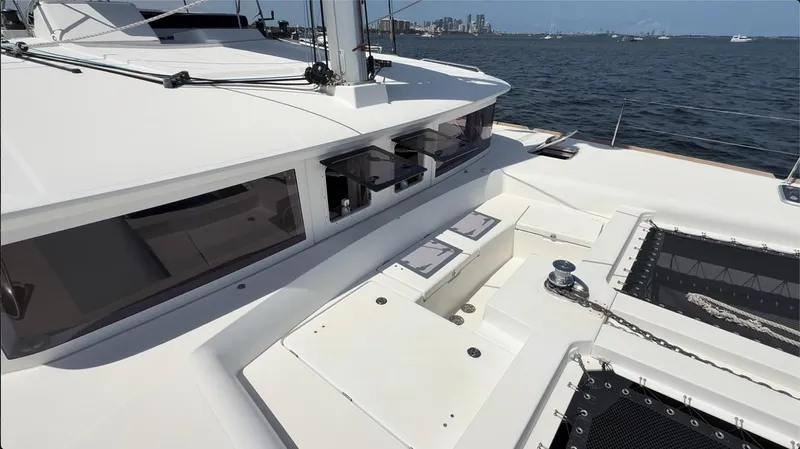 Ivana V Yacht Photos Pics 2012 Lagoon 450 catamaran deck with seating, winch, and ocean view.
