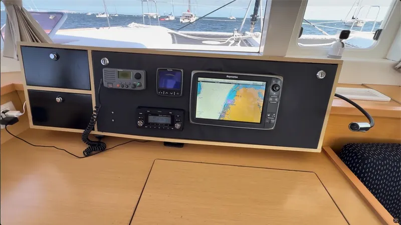 Ivana V Yacht Photos Pics Navigation station on a 2012 Lagoon 450 catamaran with electronic equipment and sea view.