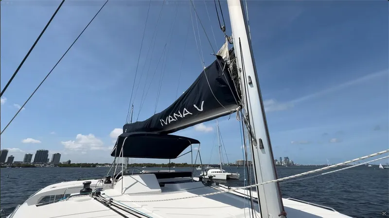 Ivana V Yacht Photos Pics Sailing yacht Lagoon 450, 2012 model, with mast and sail, on a sunny day at sea.