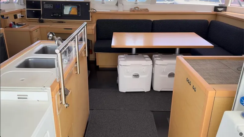 Ivana V Yacht Photos Pics Interior of 2012 Lagoon 450 yacht with kitchen and dining area.