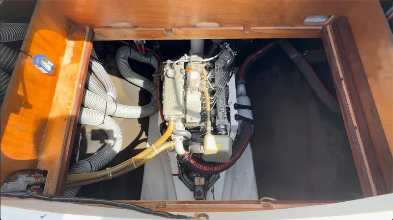 Ivana V Yacht Photos Pics Engine compartment of a 2012 Lagoon 450 catamaran, showing detailed mechanical components.