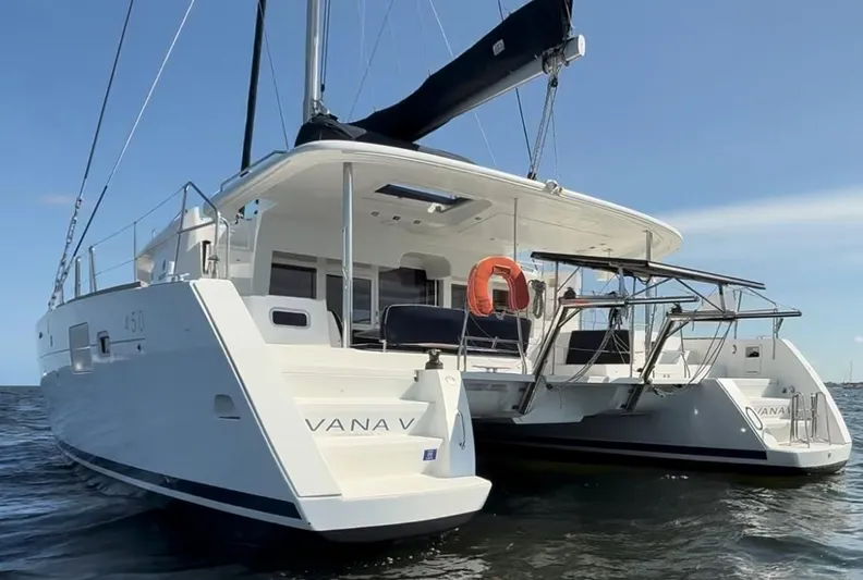 Ivana V Yacht Photos Pics 2012 Lagoon 450 catamaran on water, featuring spacious deck and modern design.