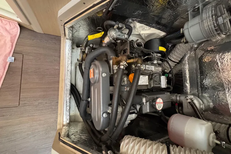 Kaifu Yacht Photos Pics Engine compartment of a 2020 Beneteau Oceanis 30.1 sailboat, showcasing mechanical components.