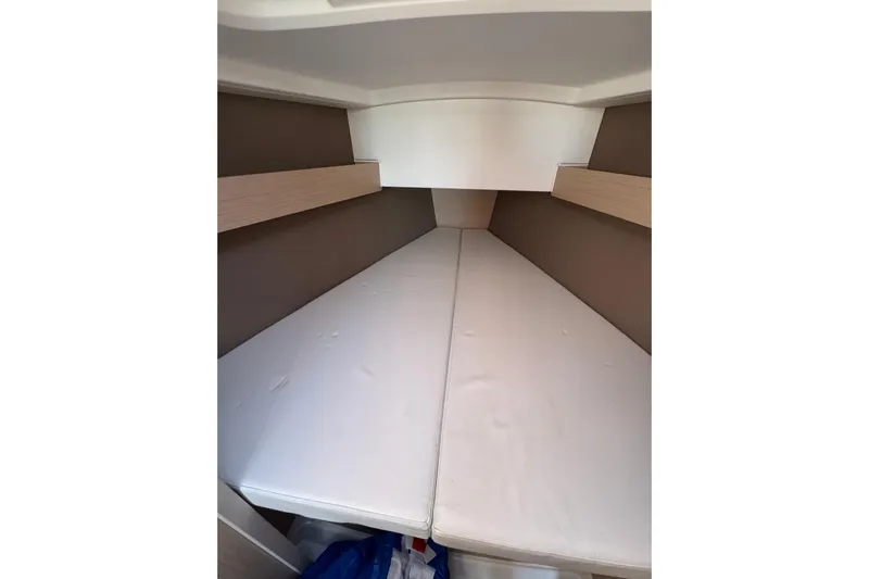 Kaifu Yacht Photos Pics Interior cabin of 2020 Beneteau Oceanis 30.1 sailboat, featuring a cozy sleeping area.