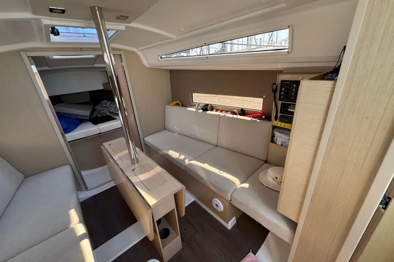 Kaifu Yacht Photos Pics Interior of 2020 Beneteau Oceanis 30.1 yacht, featuring modern seating and wooden finishes.