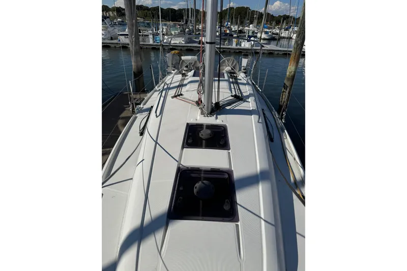 Kaifu Yacht Photos Pics 2020 Beneteau Oceanis 30.1 sailboat docked at marina, top deck view.