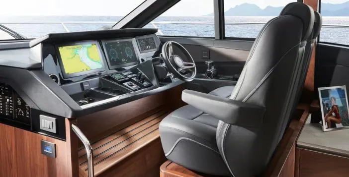  Yacht Photos Pics Helm of 2025 Princess S62 yacht with modern navigation systems and luxurious seating.
