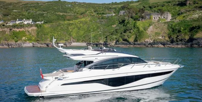  Yacht Photos Pics 2025 Princess S62 yacht cruising in scenic coastal waters.