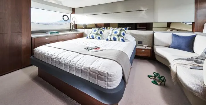  Yacht Photos Pics Luxurious bedroom interior of 2025 Princess S62 yacht with elegant decor and modern furnishings.
