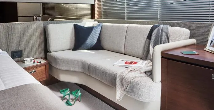  Yacht Photos Pics Luxurious interior of 2025 Princess S62 yacht with elegant sofa and decor.