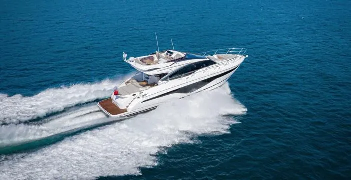  Yacht Photos Pics 2025 Princess S62 yacht cruising on open blue sea, showcasing luxury and speed.