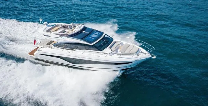  Yacht Photos Pics 2025 Princess S62 yacht cruising on open water, showcasing sleek design and luxury features.