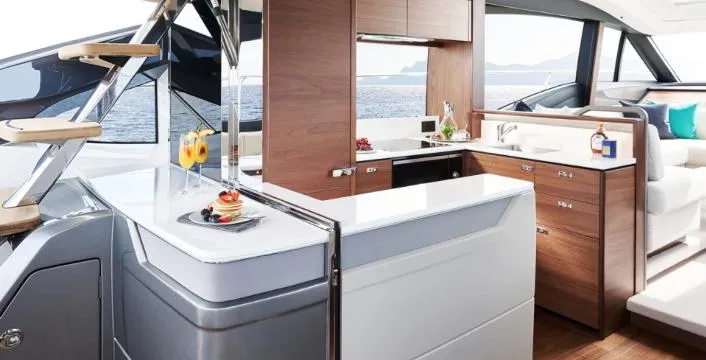  Yacht Photos Pics Luxurious interior of 2025 Princess S62 yacht with modern kitchen and elegant design.