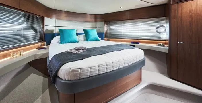  Yacht Photos Pics Luxurious bedroom interior of 2025 Princess S62 yacht with modern design and elegant furnishings.