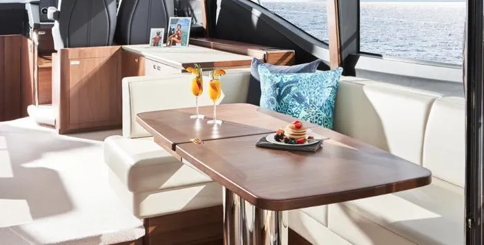  Yacht Photos Pics Luxurious interior of 2025 Princess S62 yacht with elegant dining area and ocean view.