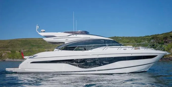  Yacht Photos Pics 2025 Princess S62 yacht cruising on open water under clear blue sky.