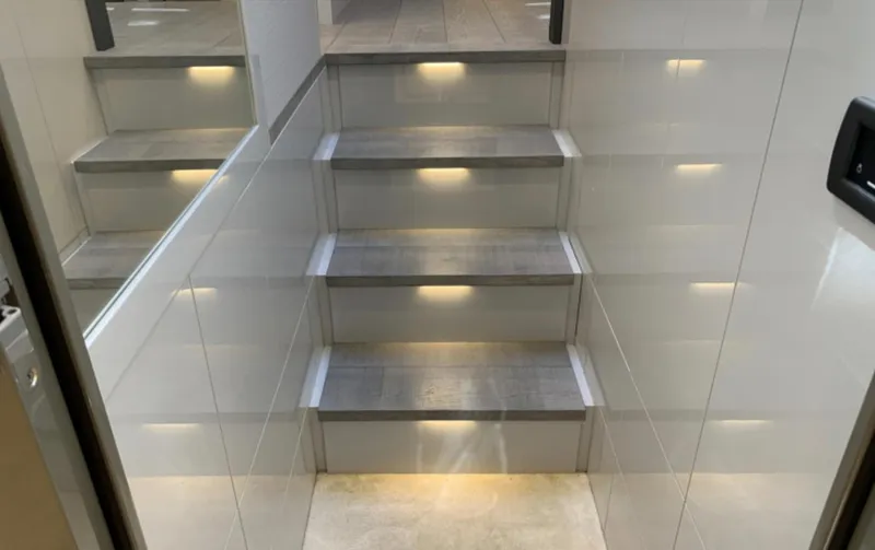  Yacht Photos Pics Staircase with ambient lighting inside a 2020 Pershing 62 yacht.